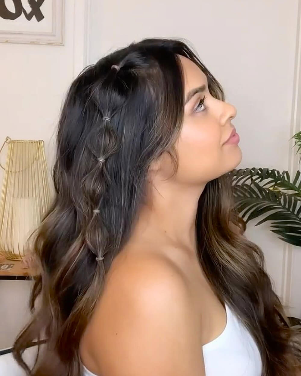 Loose waves with bubble braid accent on long brunette hair for a soft, cute, and playful style
