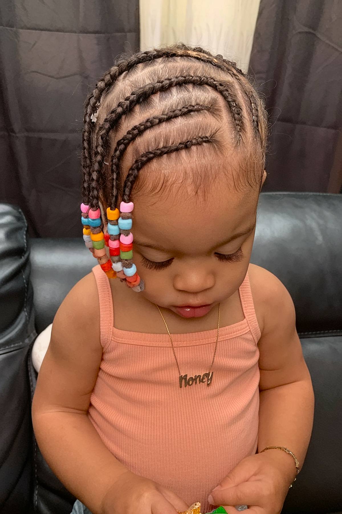 Cornrow braids toddler hairstyle with colorful beads