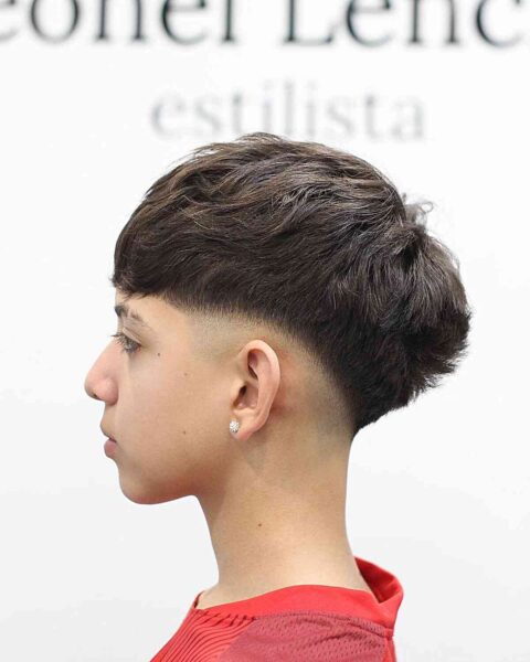 A Low Bald Fade with a Thick Top for Teen Boys