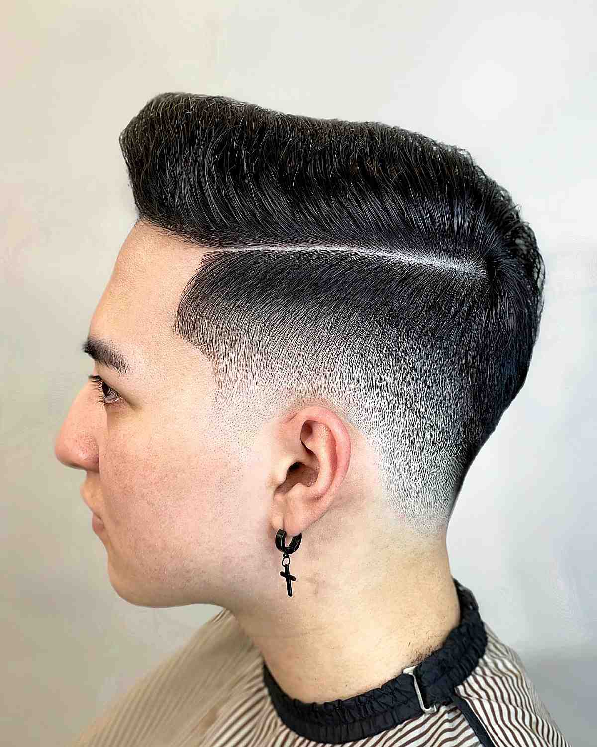 Low bald fade with combover