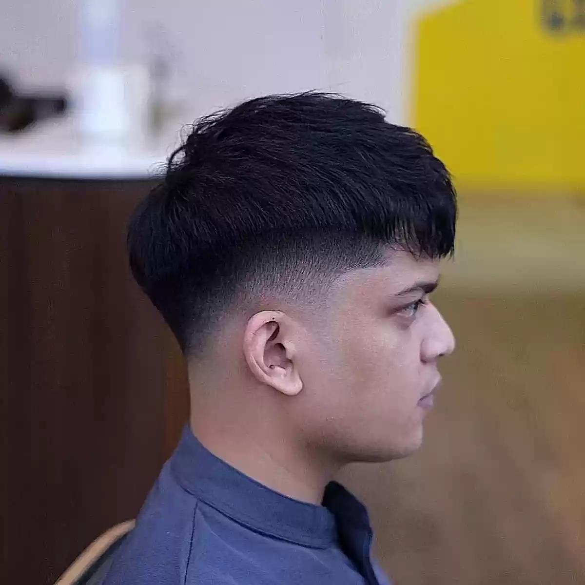 Low Fade Haircut with Flat Fringe for Men with Dense Hair