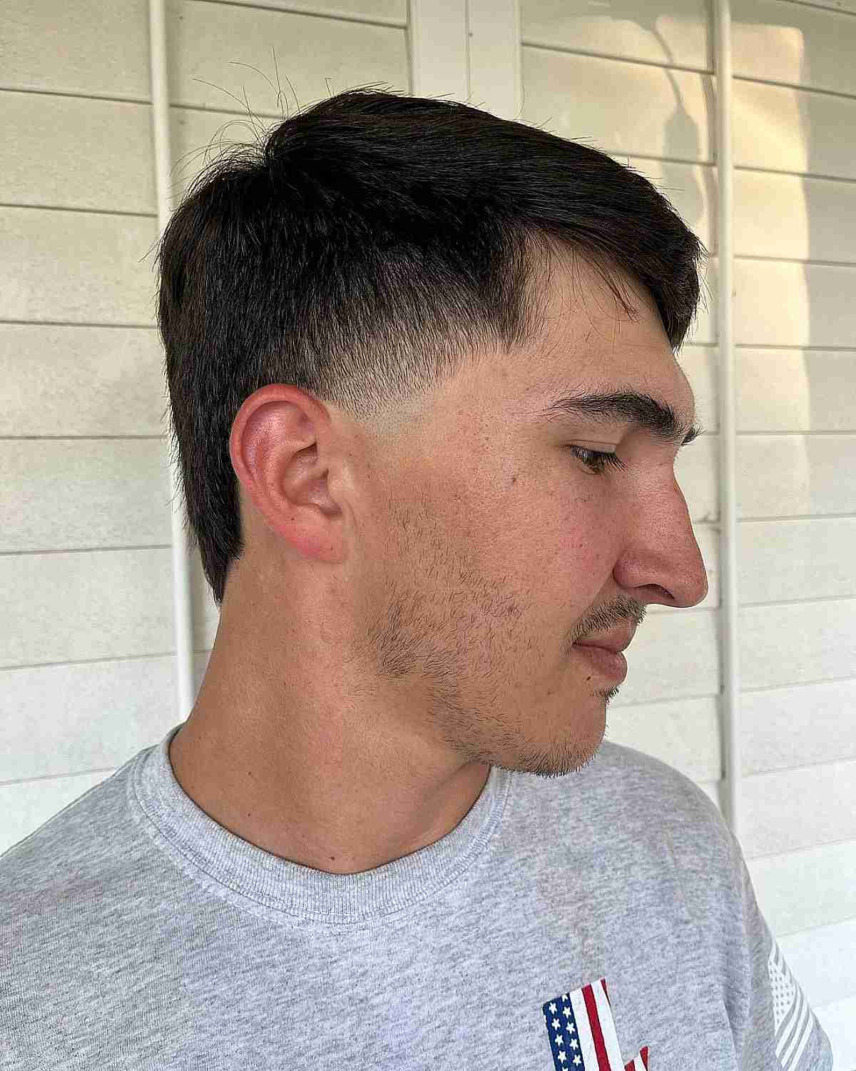Low Fade Haircut with Side Bangs