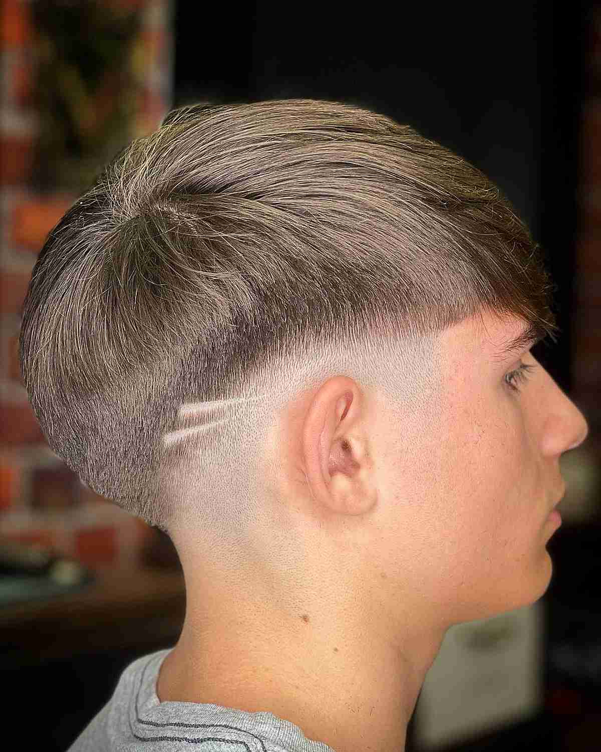Low Fade with Shaved Lines and Fringe