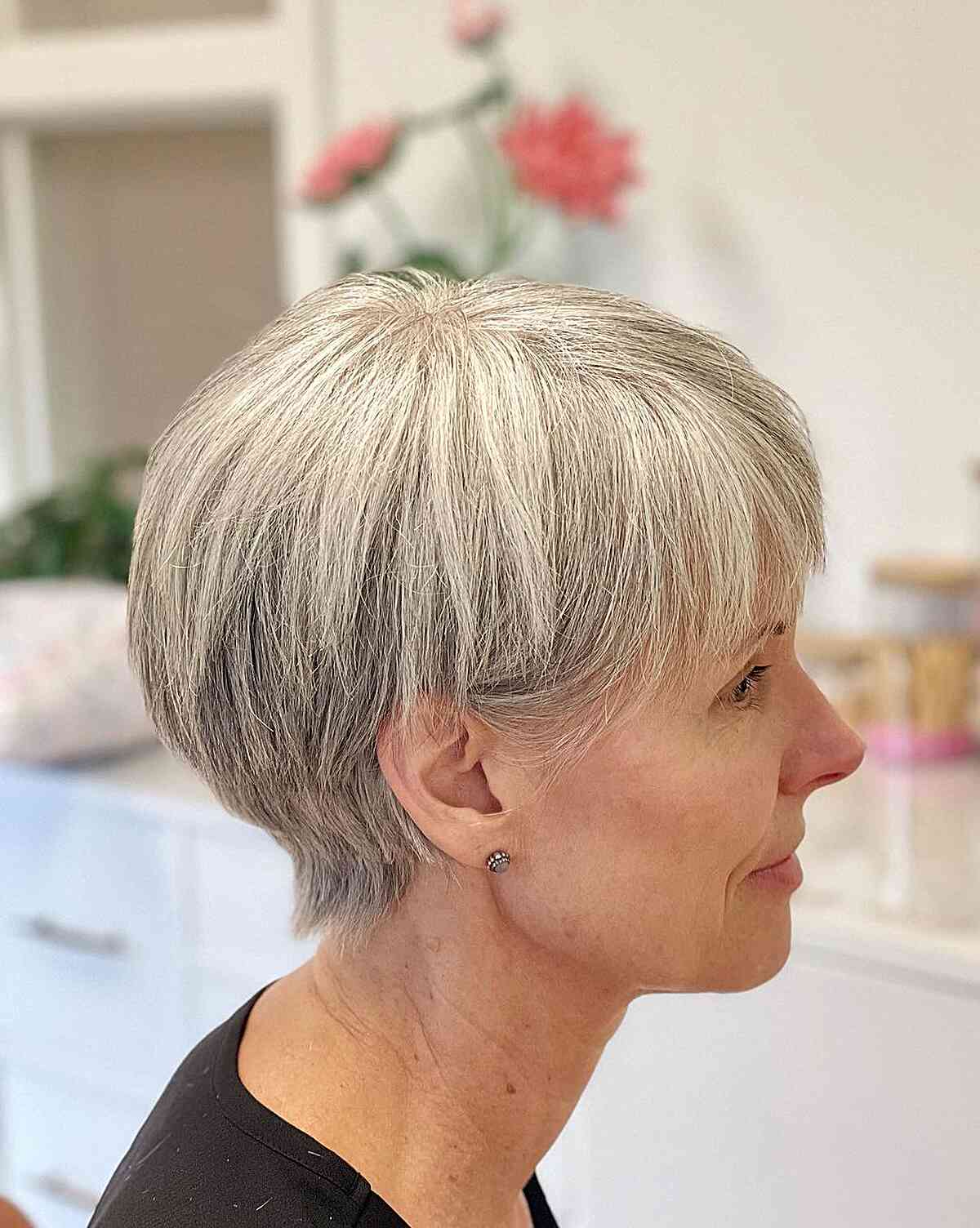 Low-Maintenance Gray Long Pixie Bowl Cut on ladies in older age