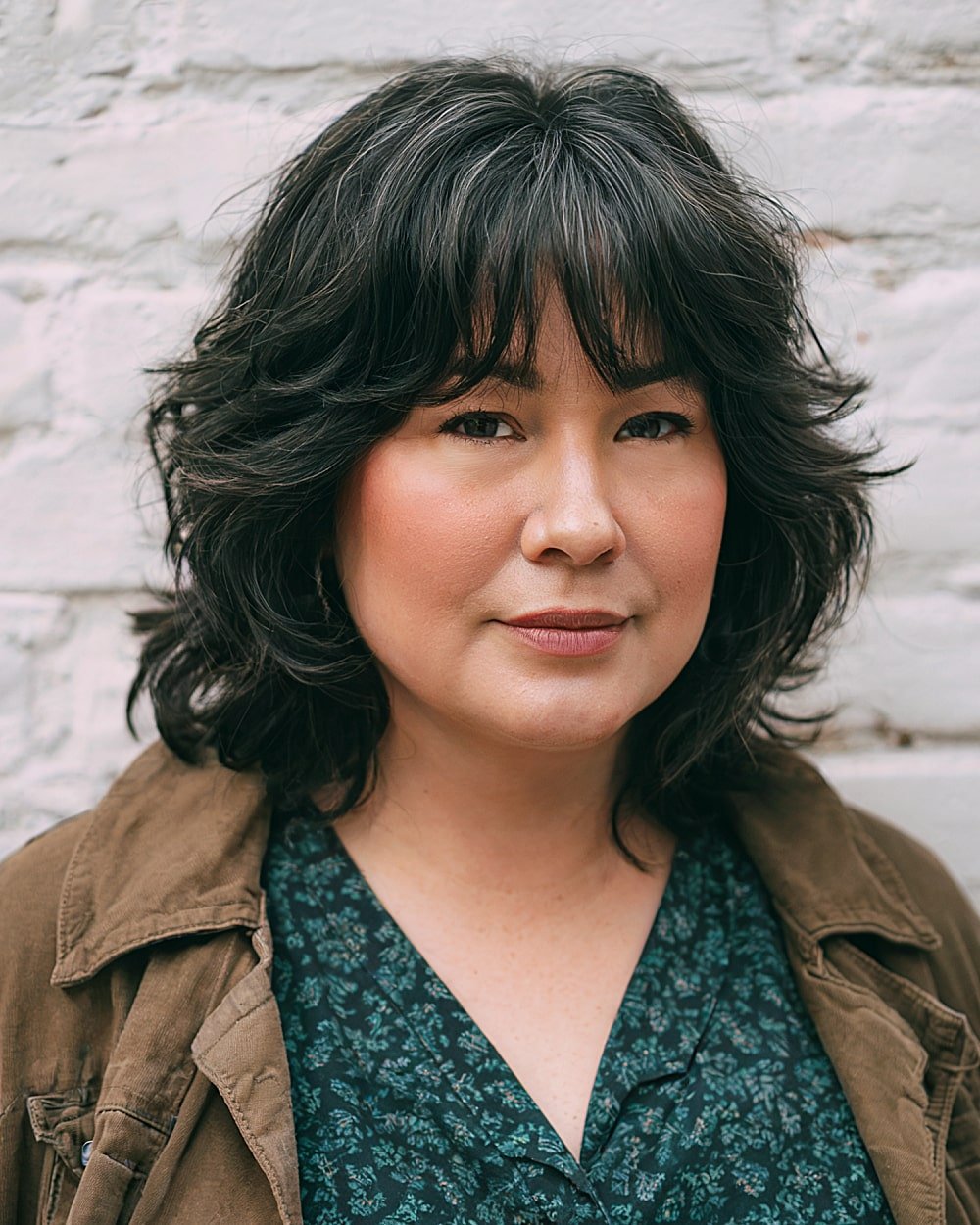 Medium low-maintenance shag with flipped ends and fringe for round-faced women over 40