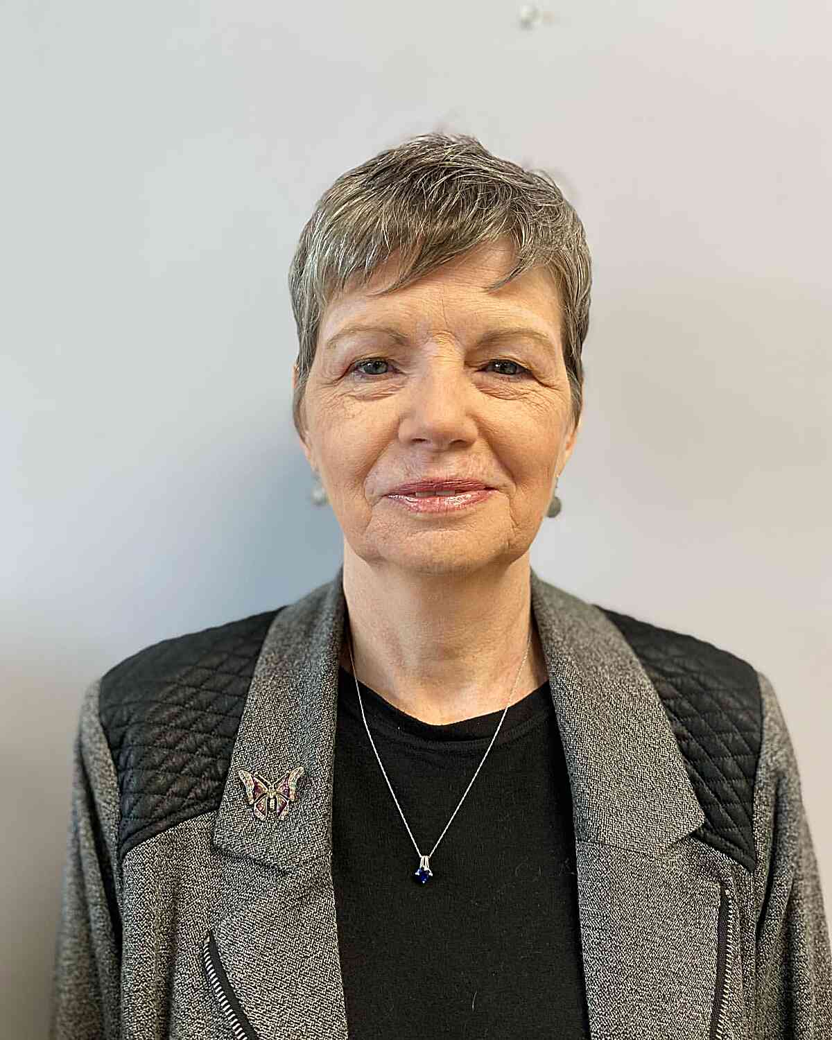 Low-Maintenance Razor Cut Pixie with Bangs for Older Women Past 50 with Grey Hair