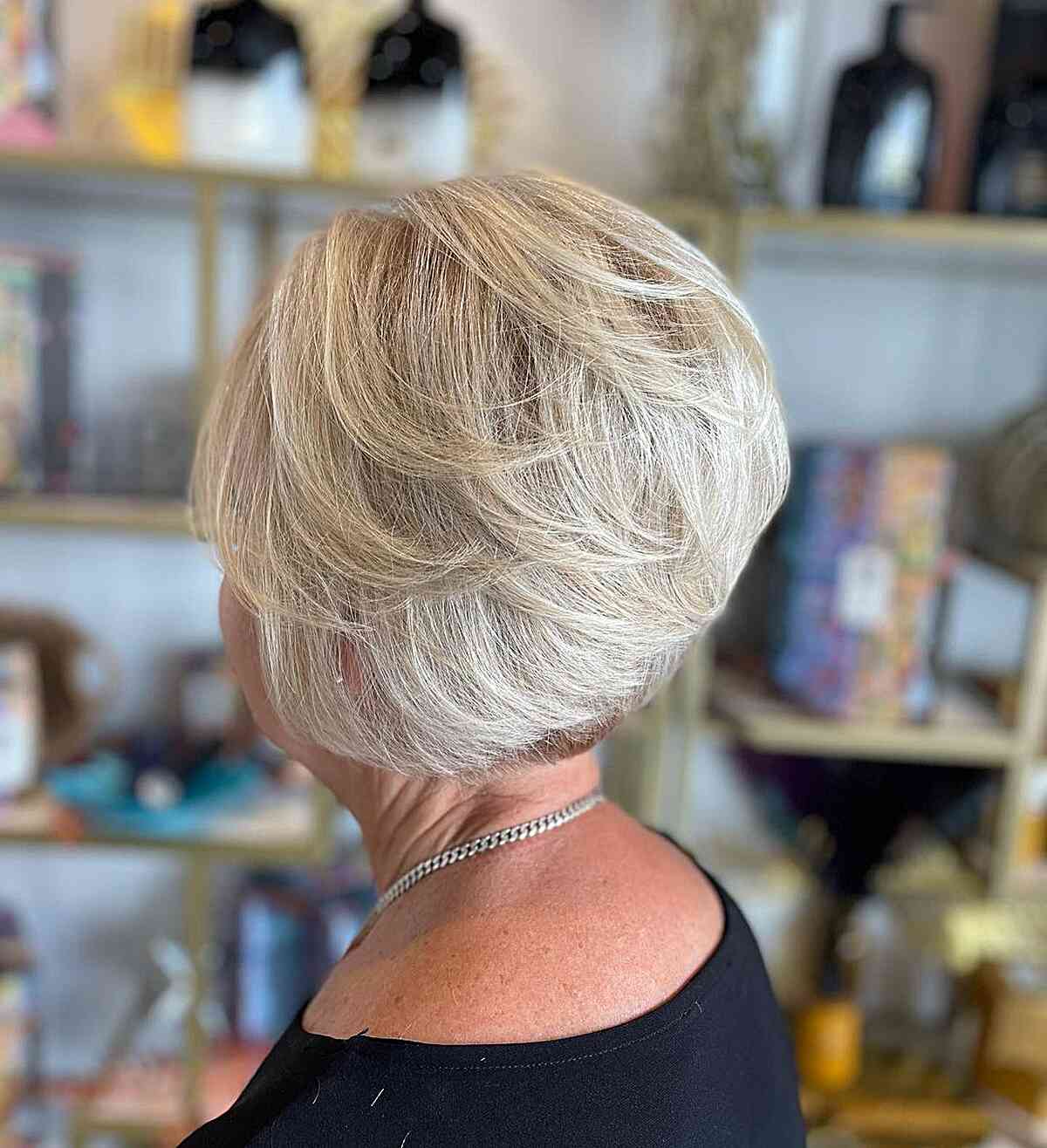 Low-Maintenance Short Feathery Wedge Cut for Ladies Over Sixty with Fine Hair