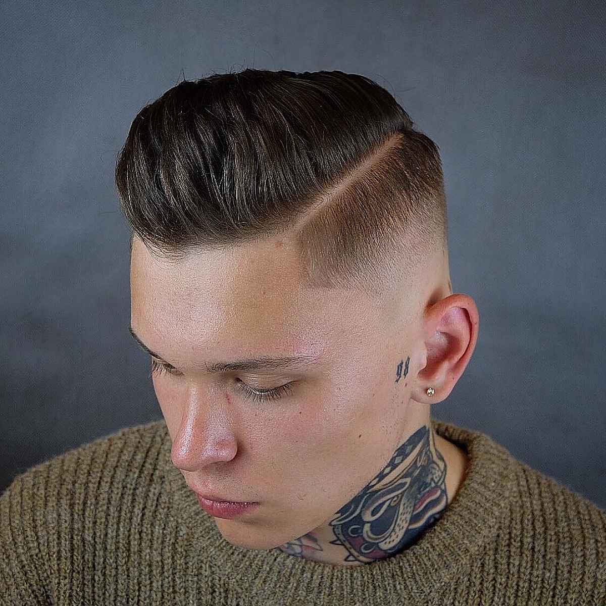 Vintage low mid fade with a side part