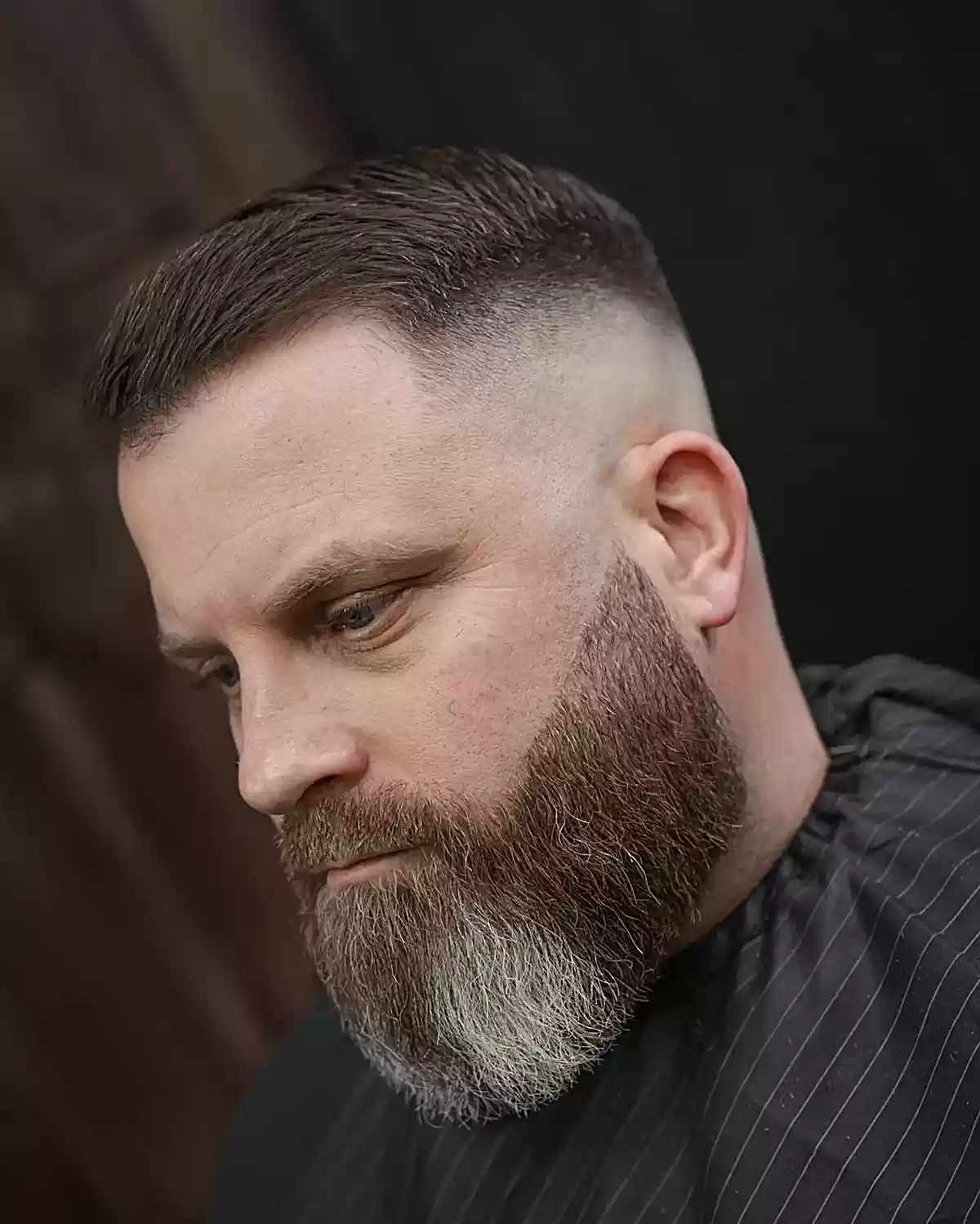 Low Side-Swept Pomp with Disconnected Skin Fade and Beard Fade