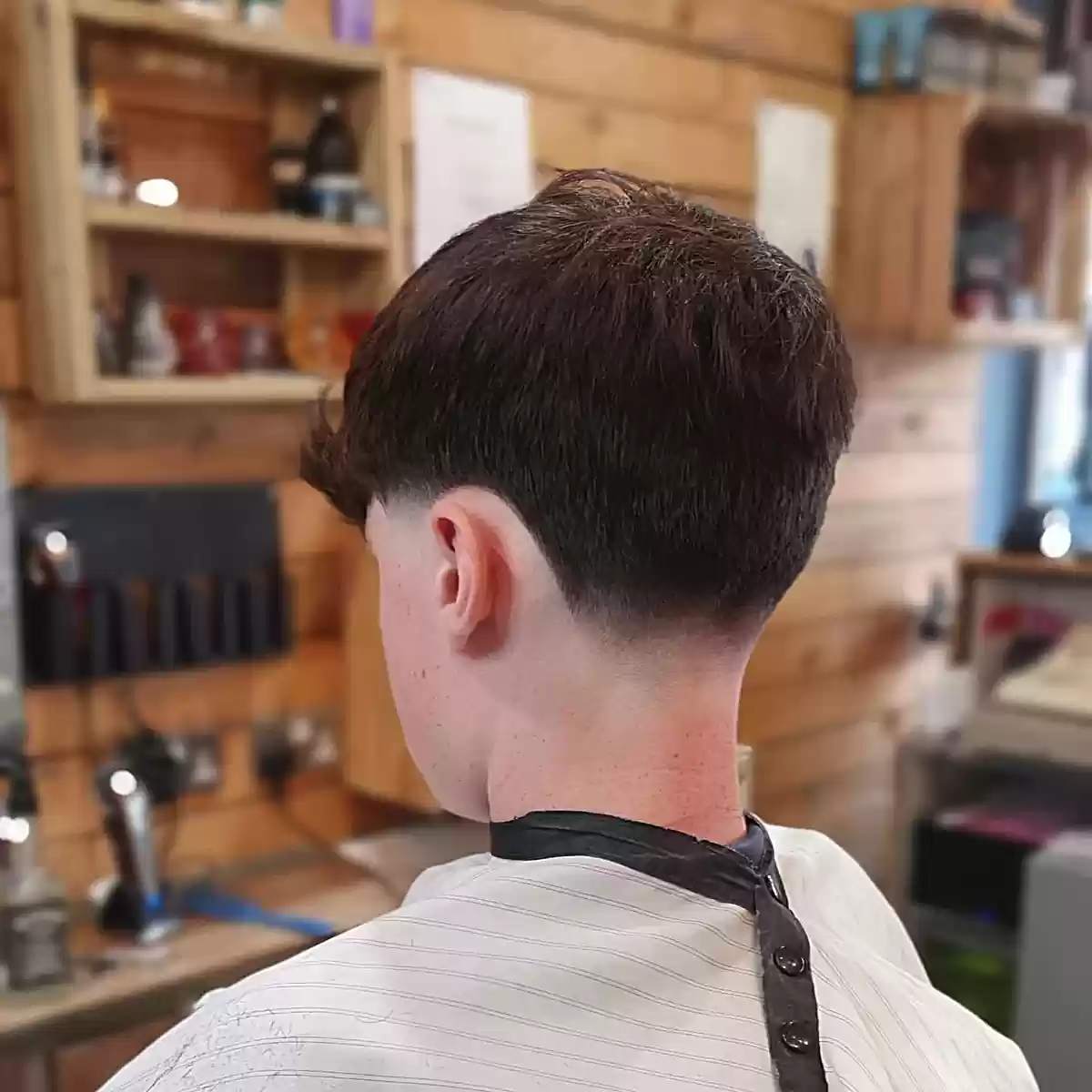 Low Skin Taper Fade on young men with straight hair
