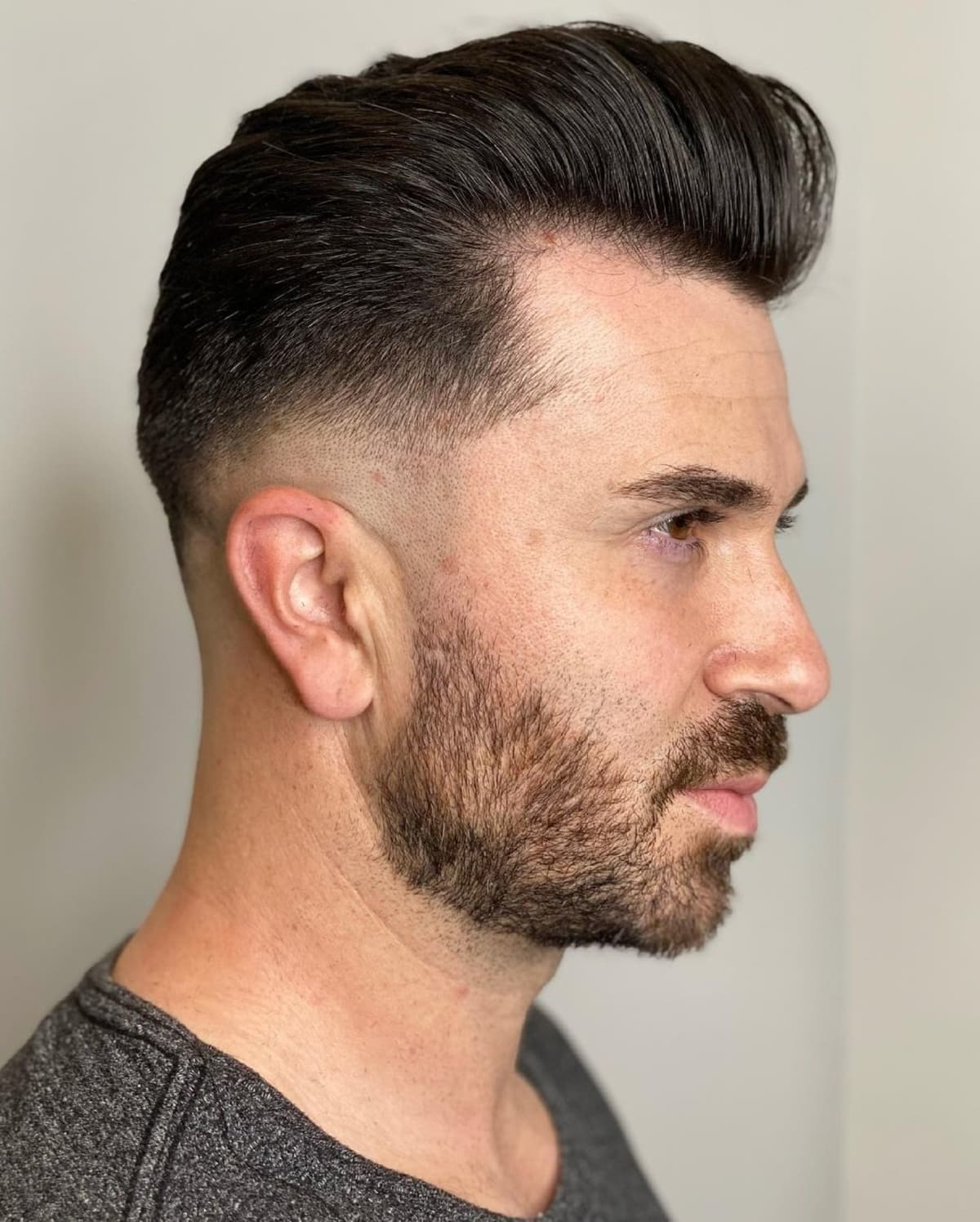 Low taper fade pomp on thin hair