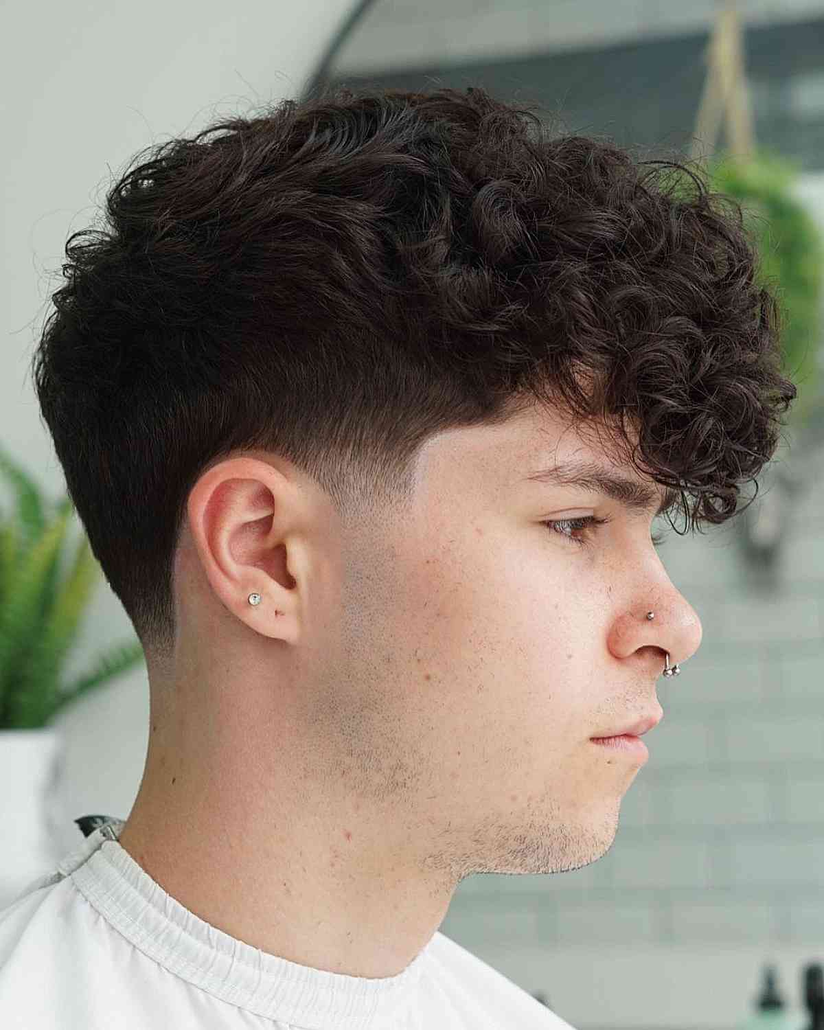 Classic Low Taper Fade with Loose Curls on Top for Men