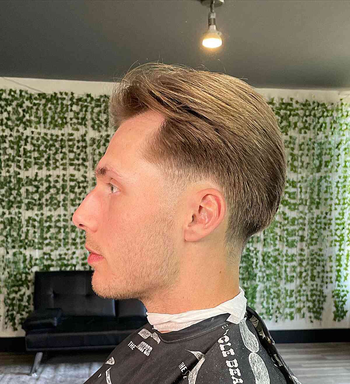 Low Taper Faded Blonde Brush Back on Men with Straight Hair