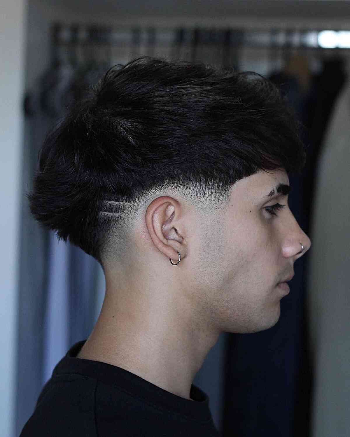 Low Taper with Shaved Designs on Men with Thick Hair