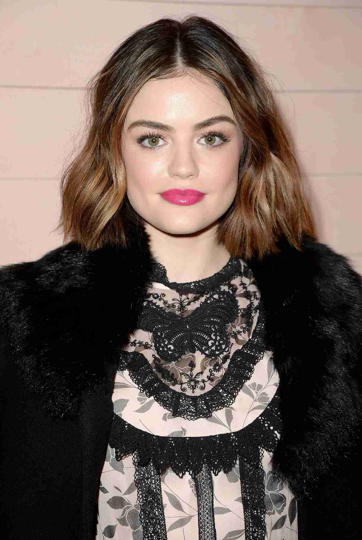 Lucy Hale with a long bob haircut and middle part