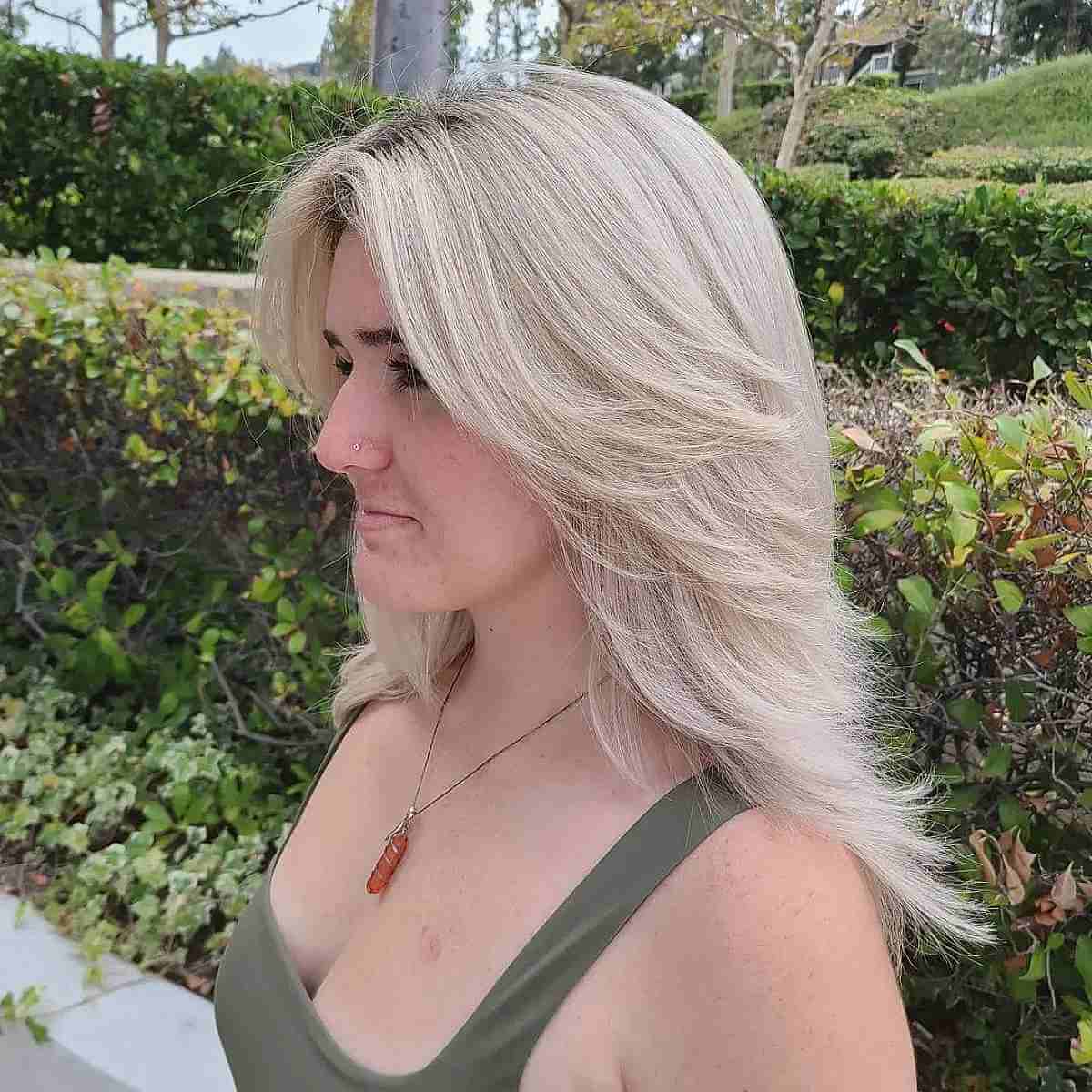 Medium '80s Center Part Blonde Hair with Choppy Layers