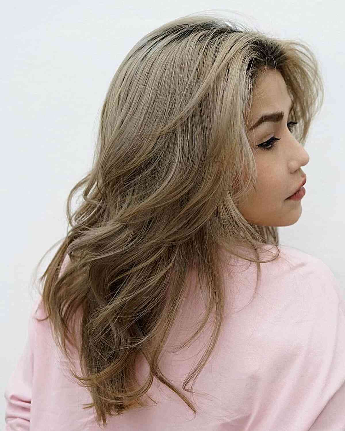Medium Blonde Butterfly Haircut with Soft Layers and Middle Part Style