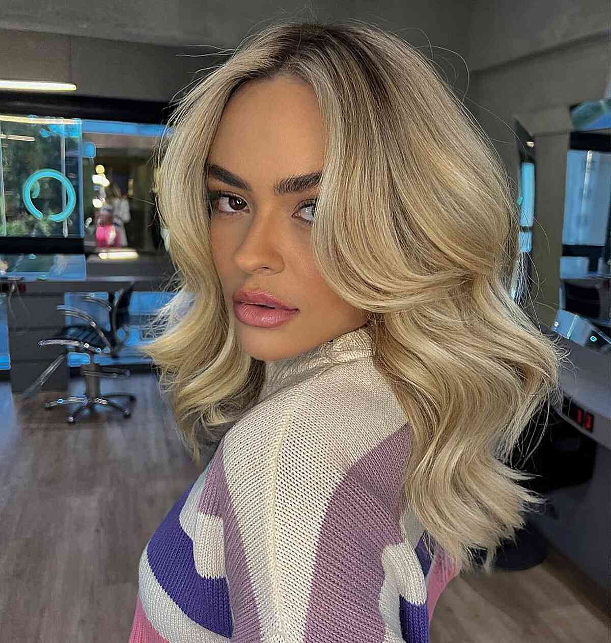 Medium Blonde Thick Waves with Face-Framing Layers