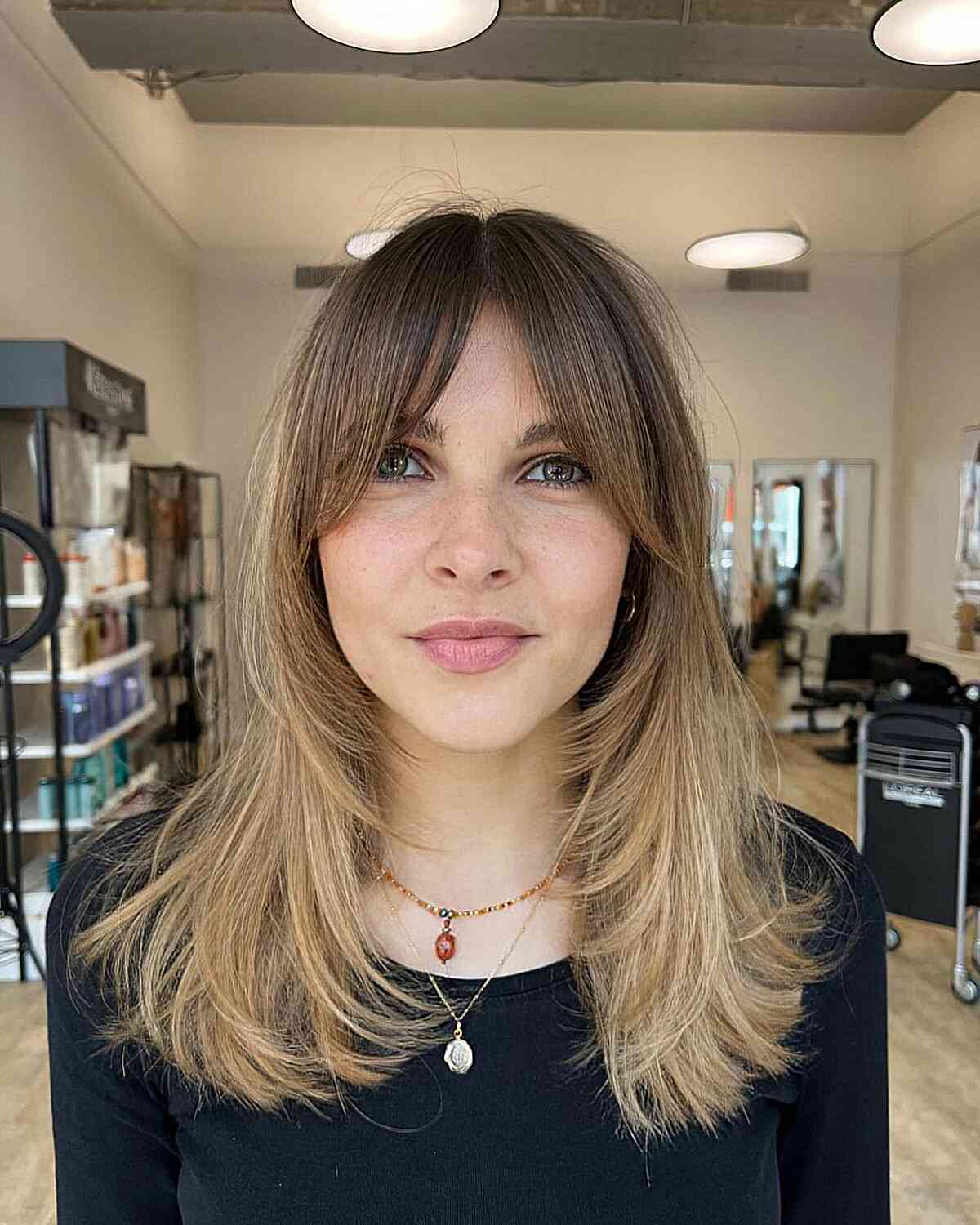 Medium Butterfly Cut with Curtain Bangs and Brown-Blonde Ombre