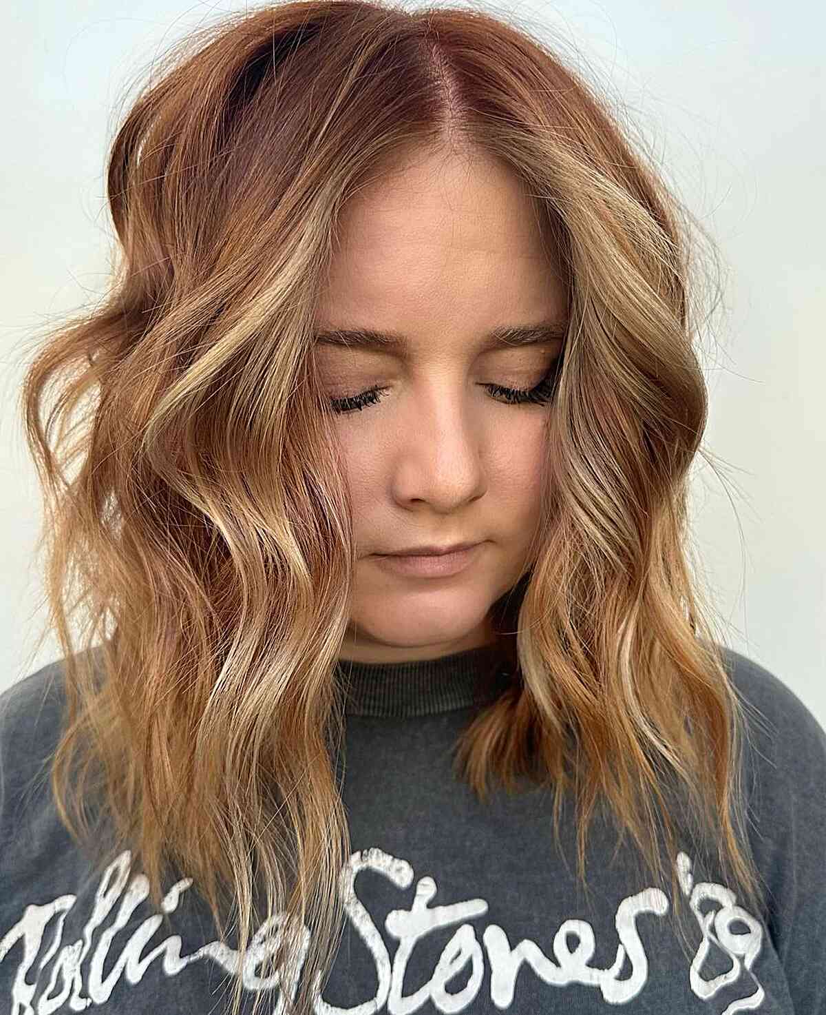 Medium Choppy Layers with Highlights and a middle part