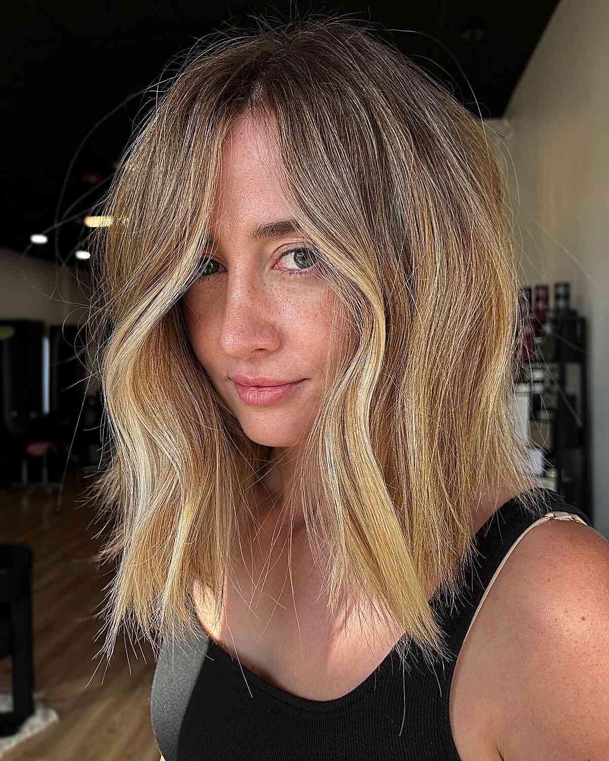 Medium Face-Framing Choppy Layers with Dirty Blonde Tones