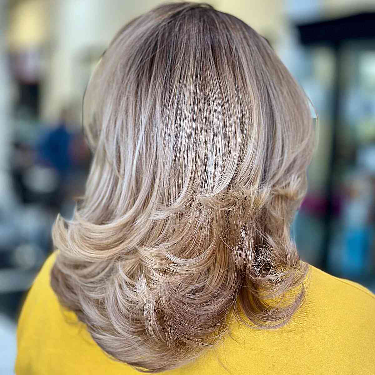 Medium Feathered Thick Hair with Rooted Creamy Blonde Color
