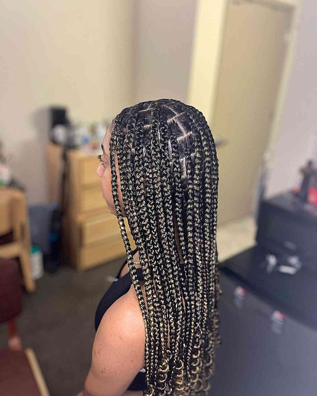 Long-Length Medium Knotless Braids with Subtle Blonde Highlights and Curly Ends