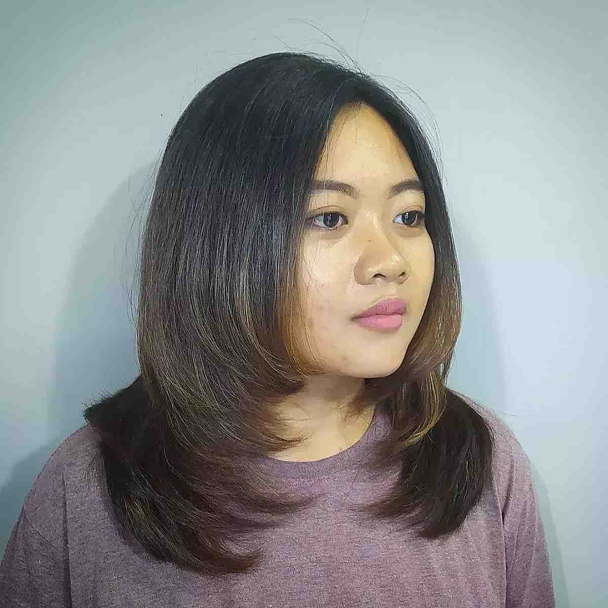 Elegant Medium Layered Straight Hair for Round Faces