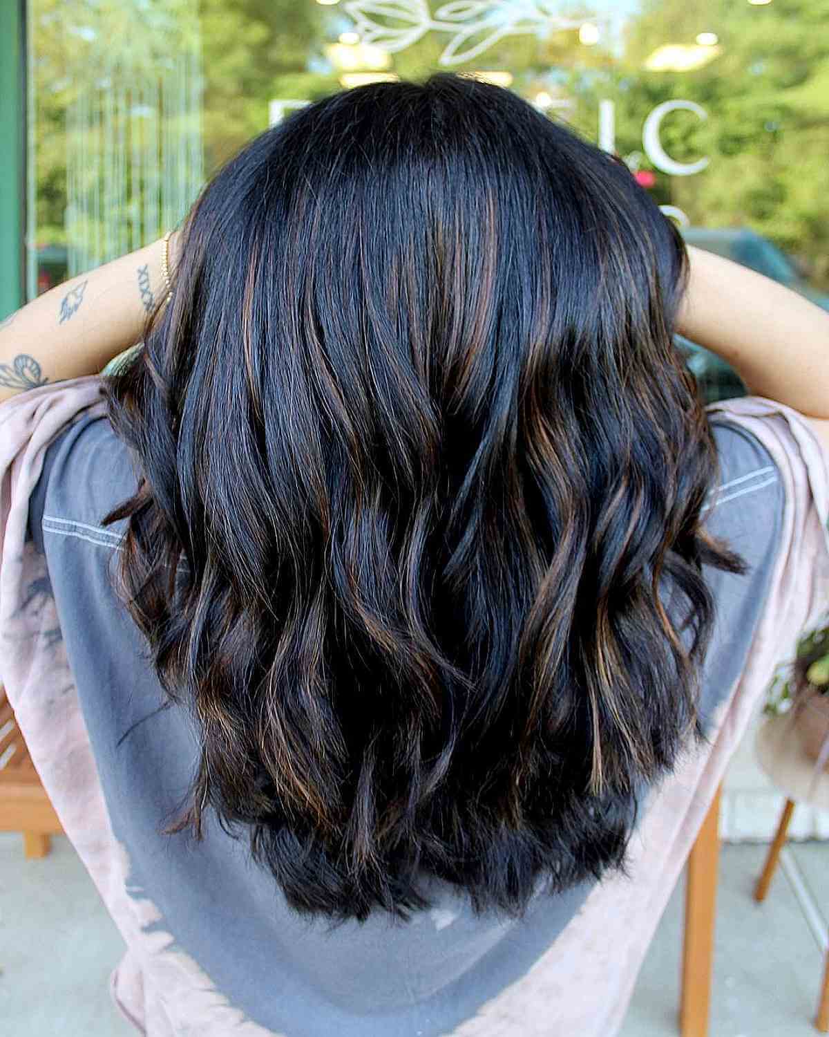 Medium-Length Black Hair with Light Brown Highlights