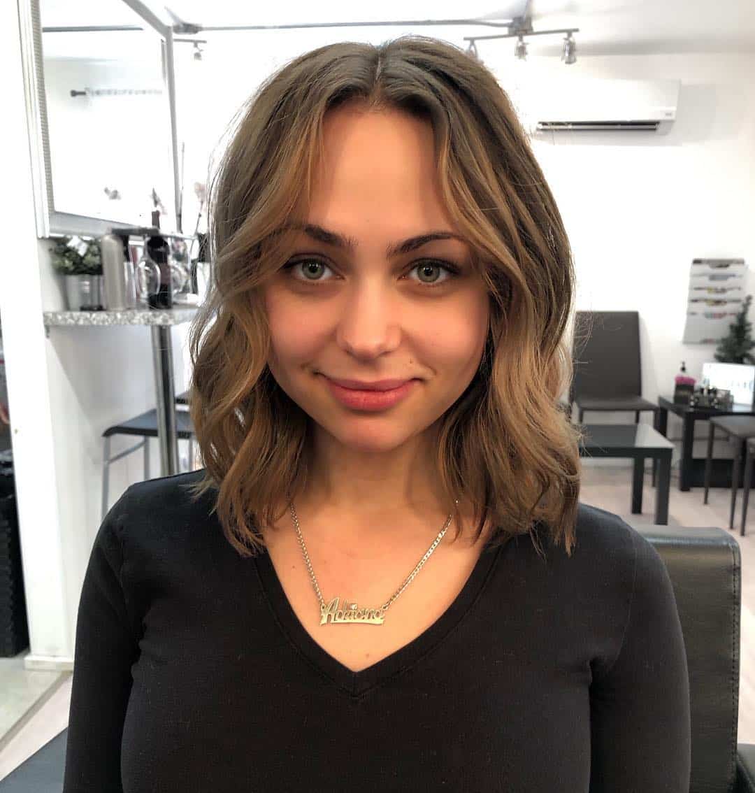 Medium Length Bob with Middle Part and Wavy Style