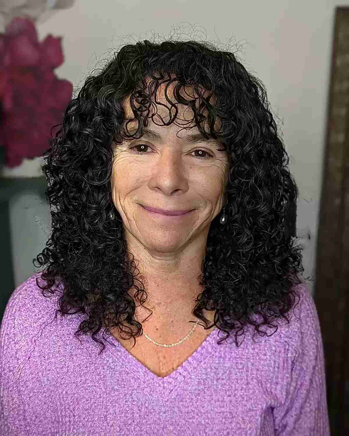 Medium-Length Curls with Piece-y Bangs for older women over 60