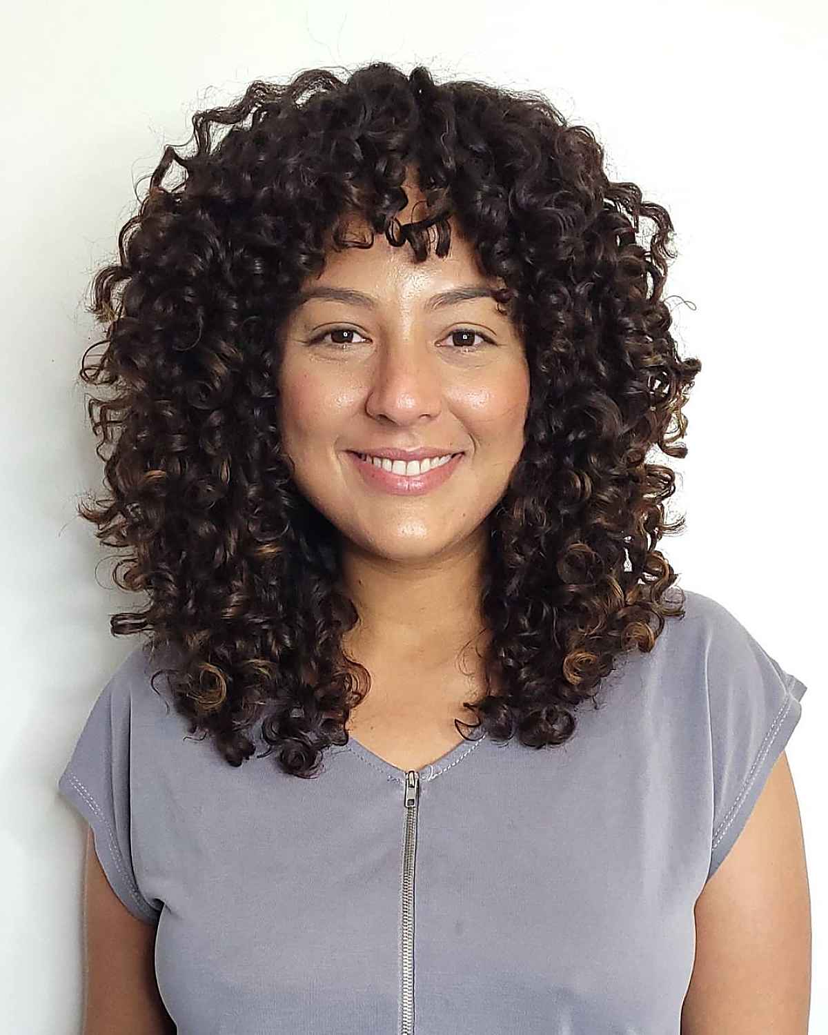 beautiful medium-length curly shag hairstyle