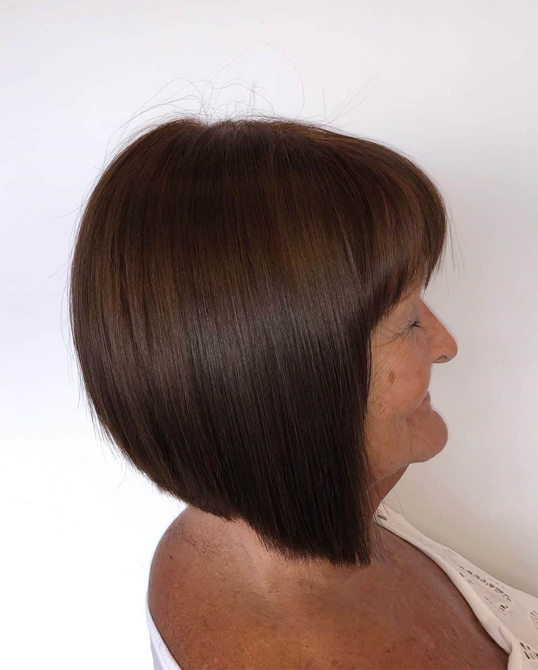 medium length cut for woman over 70 with dark brown hair