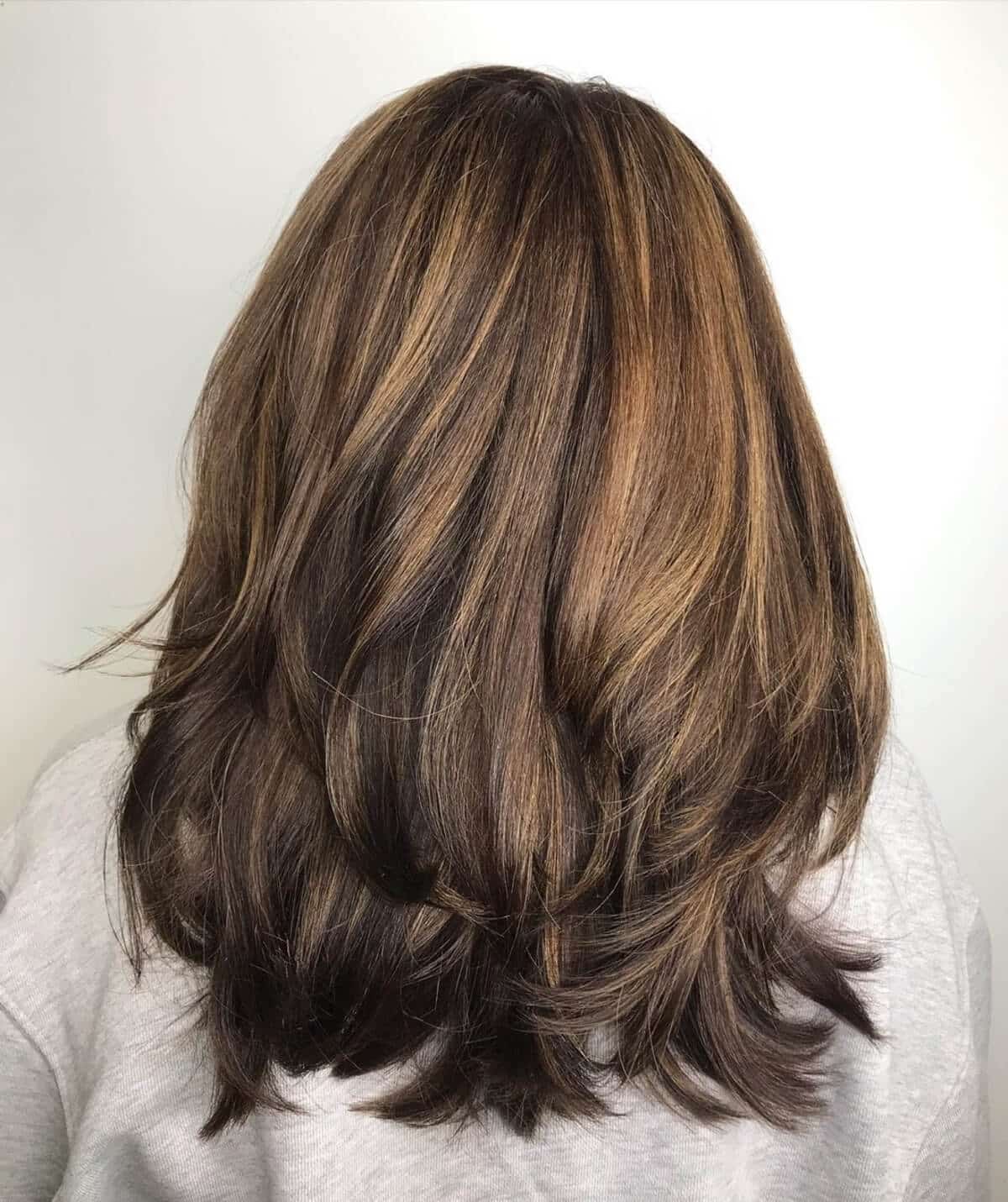 medium length dark brunette brown hair with caramel highlights