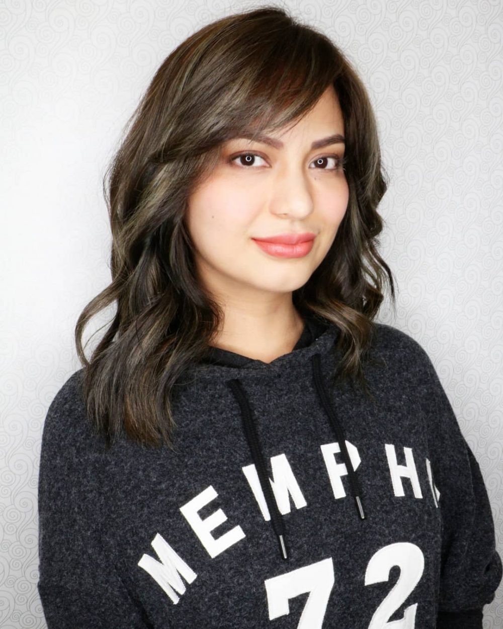 Sexy medium-length hairstyle with swept bangs