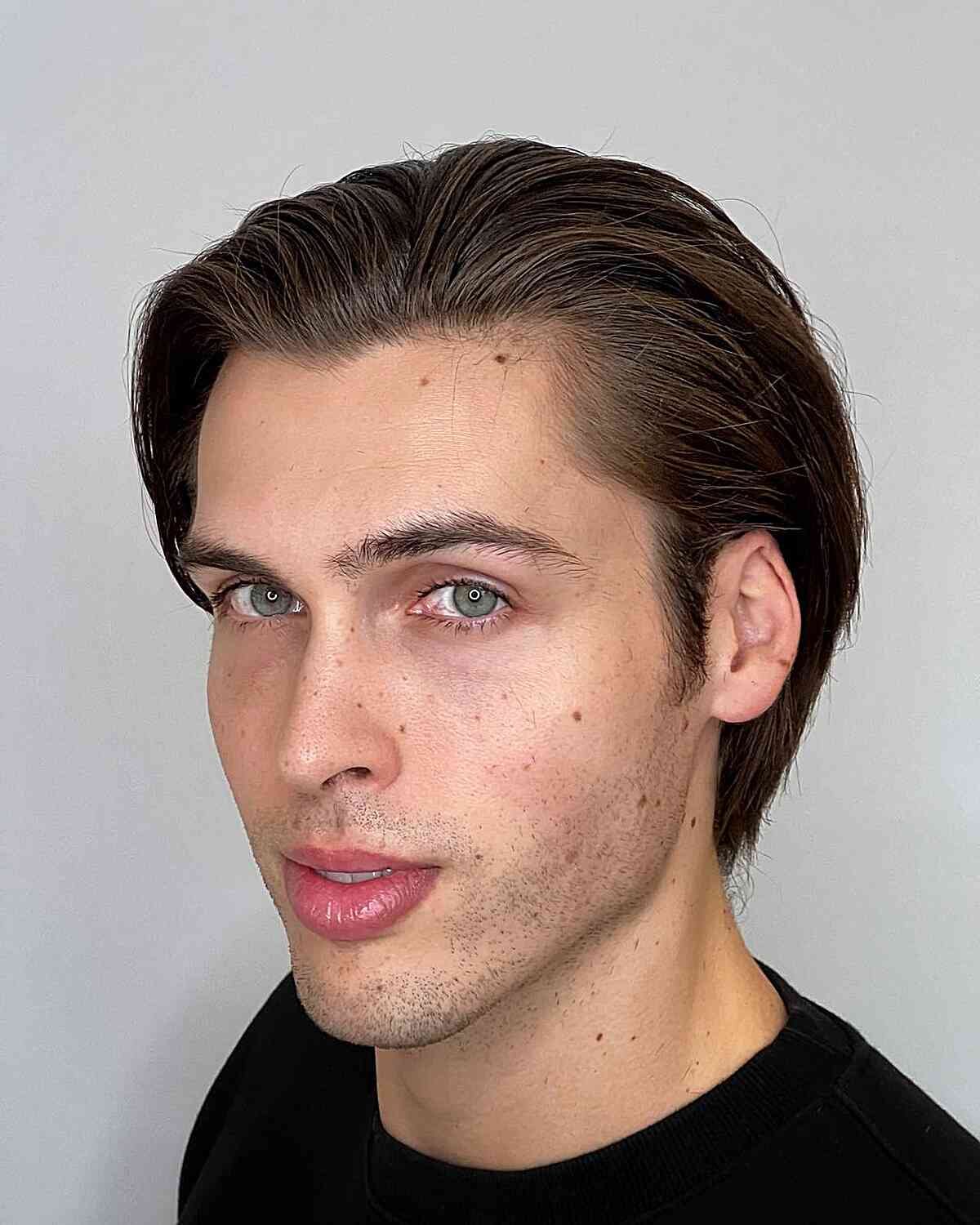 Medium-Length Slicked Back with No Fade for Guys
