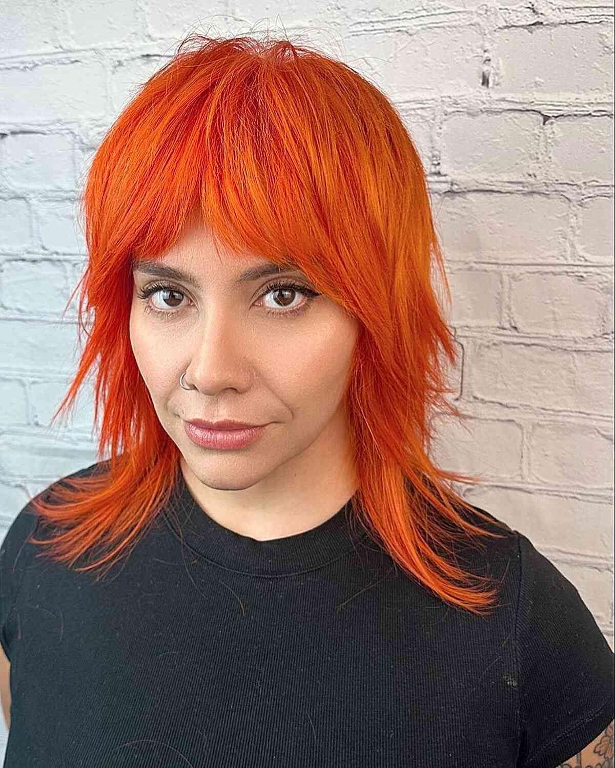 Medium-Length Tangerine Shag with Bangs for girls with an edgy style