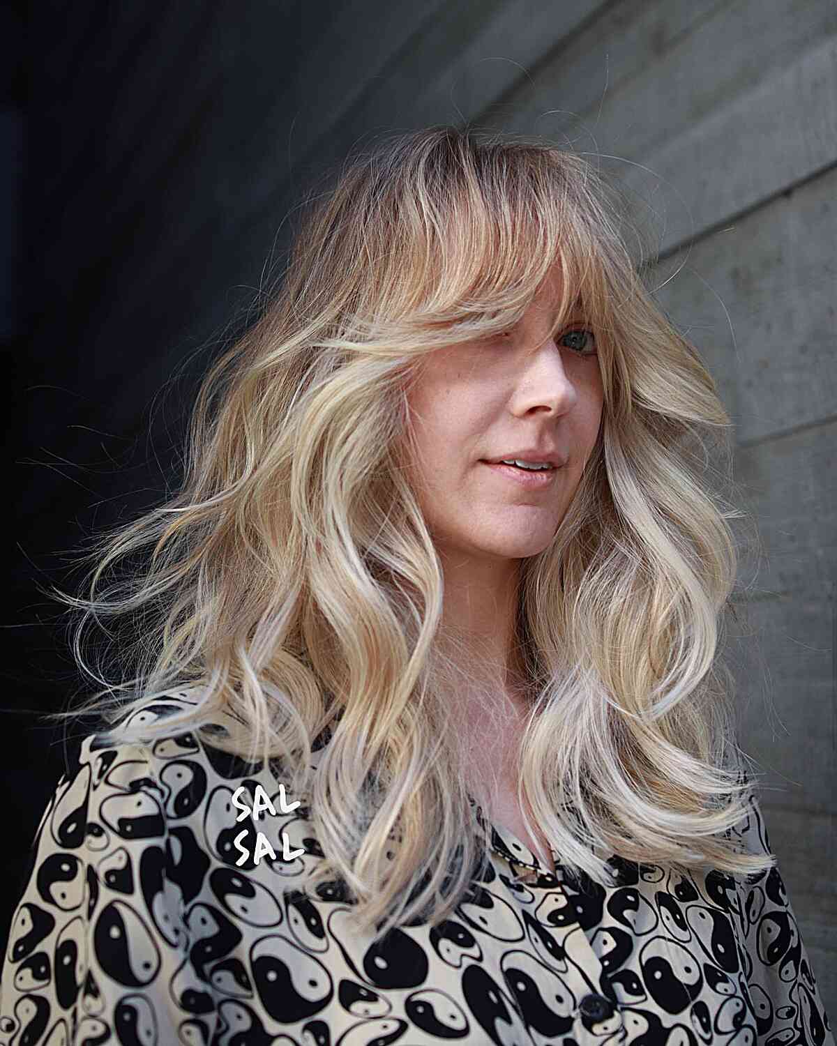 Medium-Length Thick Blowout Waves with Curtain Fringe and Blonde Balayage