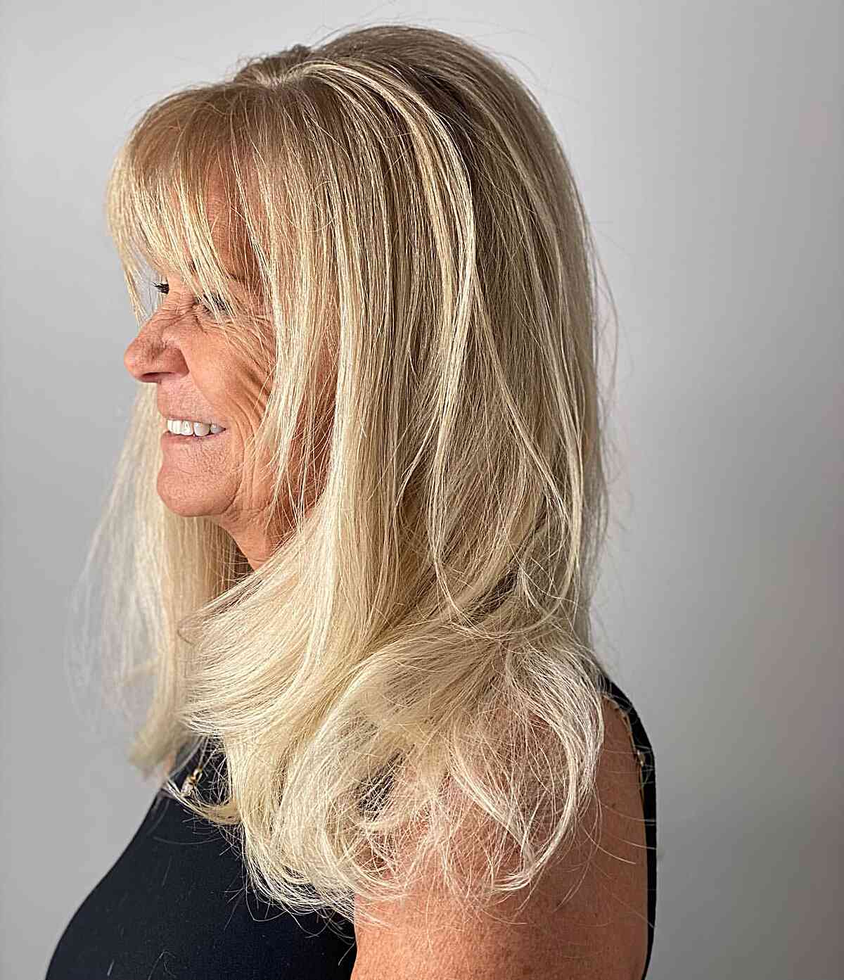 Long-Length Vanilla Blonde Hair with Front Bangs for Older Ladies Aged 50