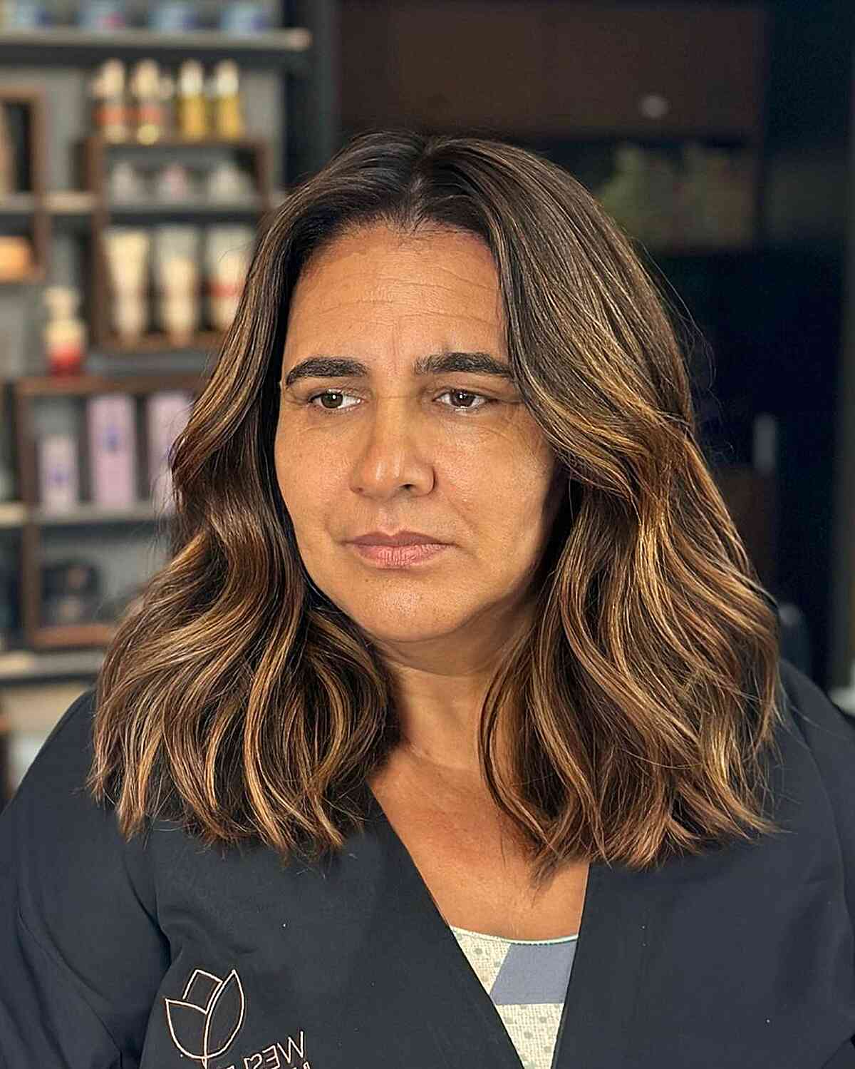 Medium-Length Waves with Golden Highlights on Older Women with Thick Hair