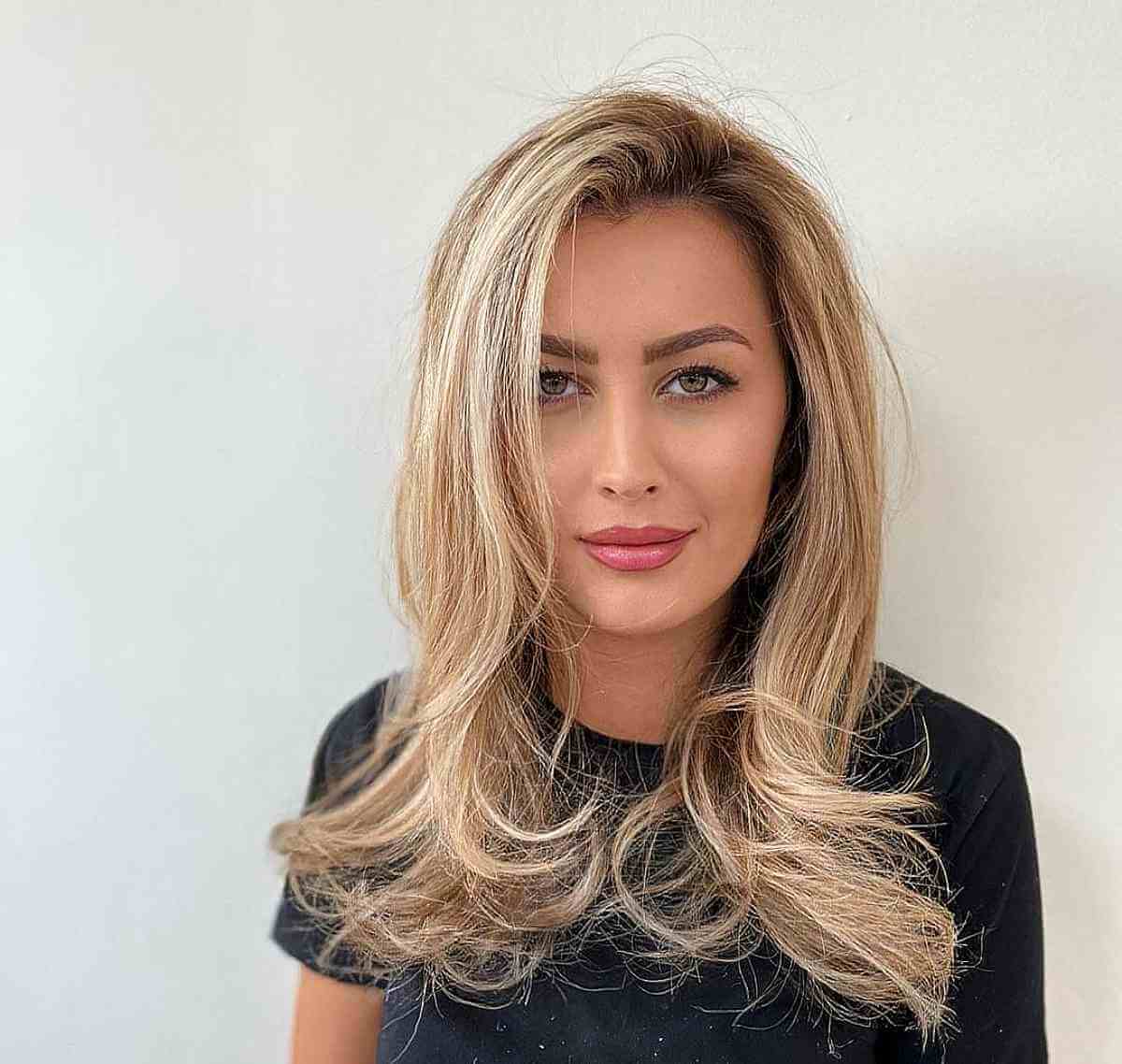 Medium-Long Blonde Hair with a Side Part 