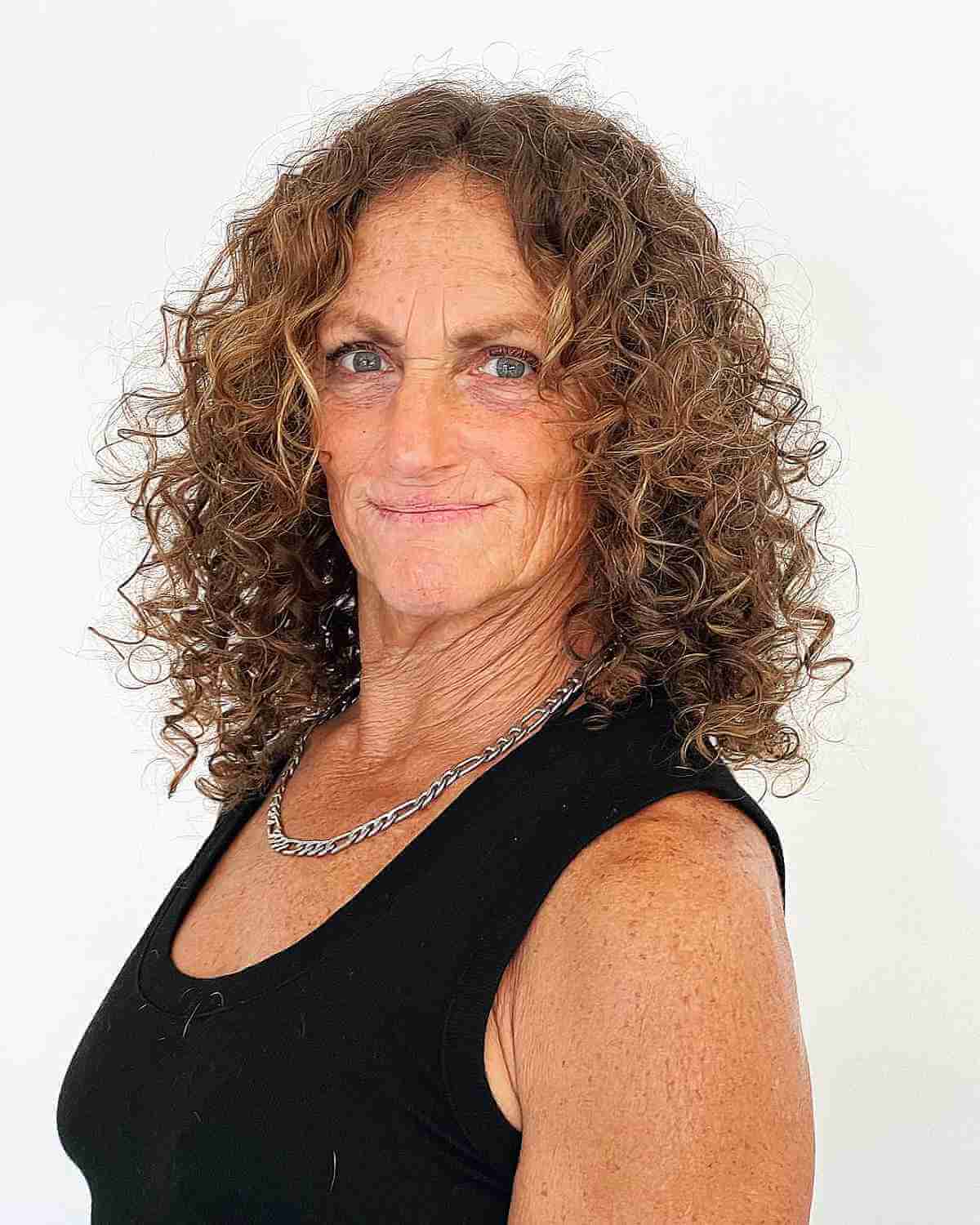 Medium Middle-Parted Frizzy Curls for Ladies Over Sixty