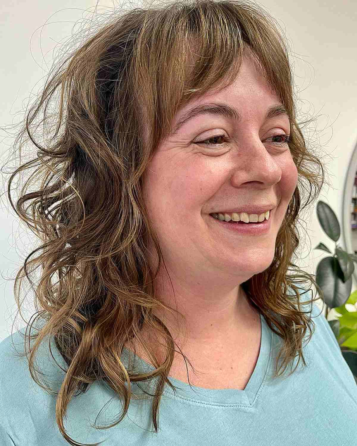 Medium Shaggy Cut with Loose Curls for 50-Year-Olds