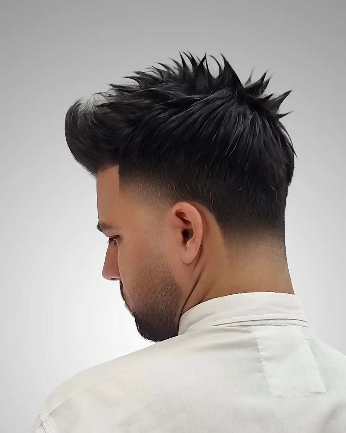 Medium Spiky Hair with Low Taper Fade for Men