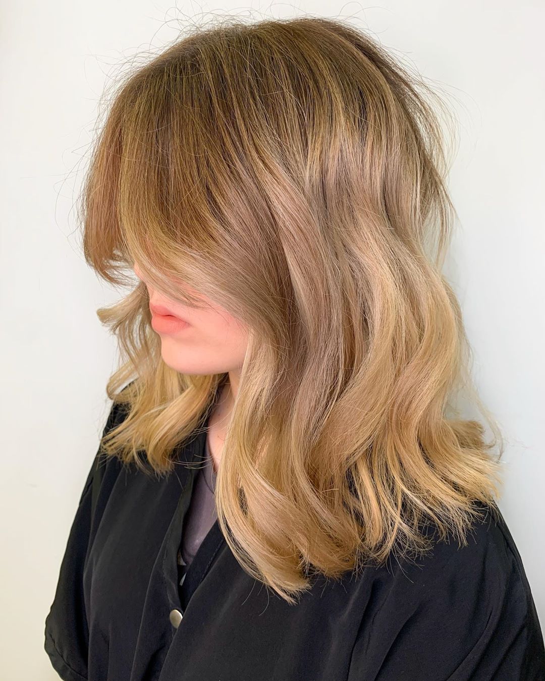 Medium to Long Rich Blonde with Curtain Bangs