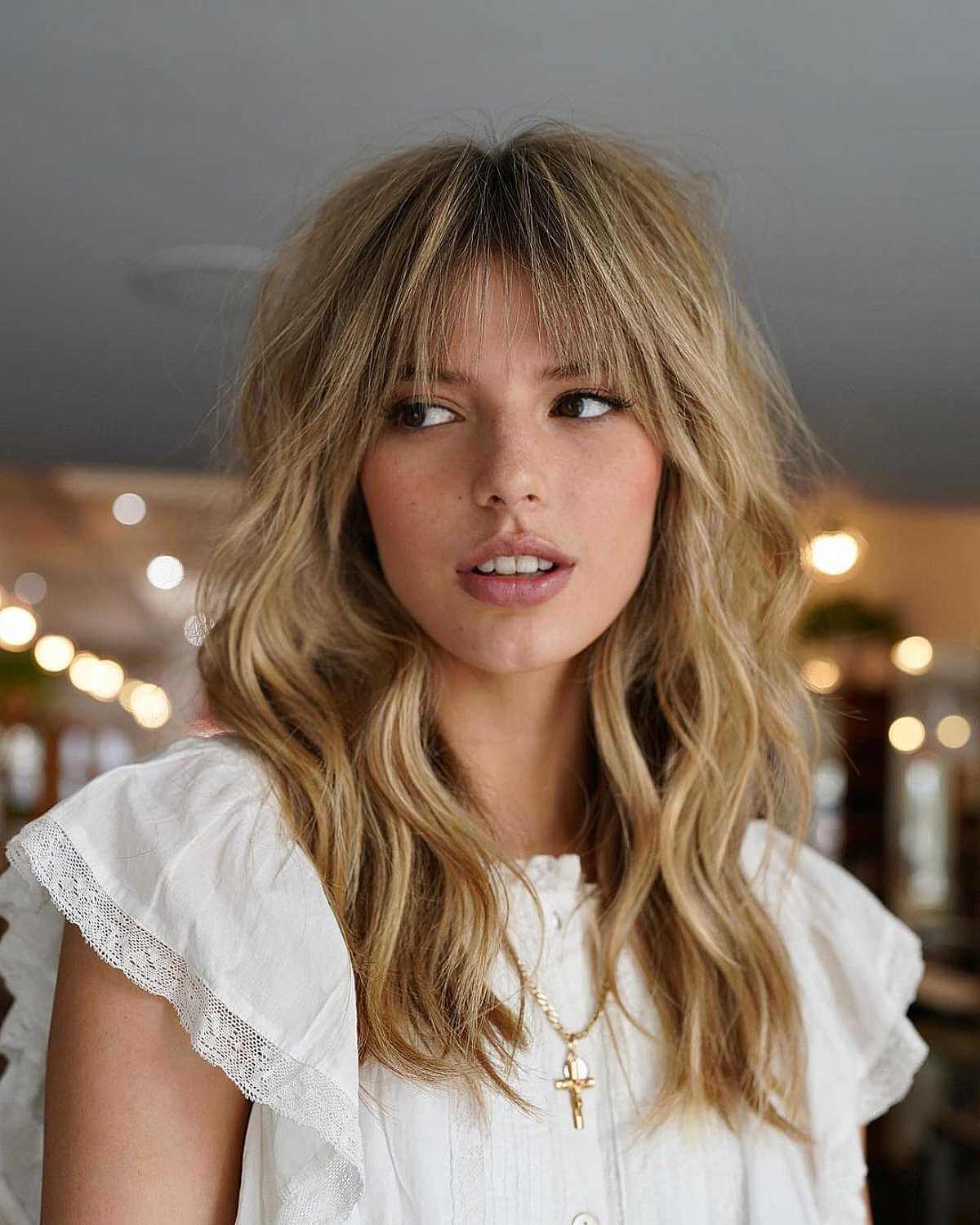 Medium Undone Blonde Hair with See-Through Bangs and Layers