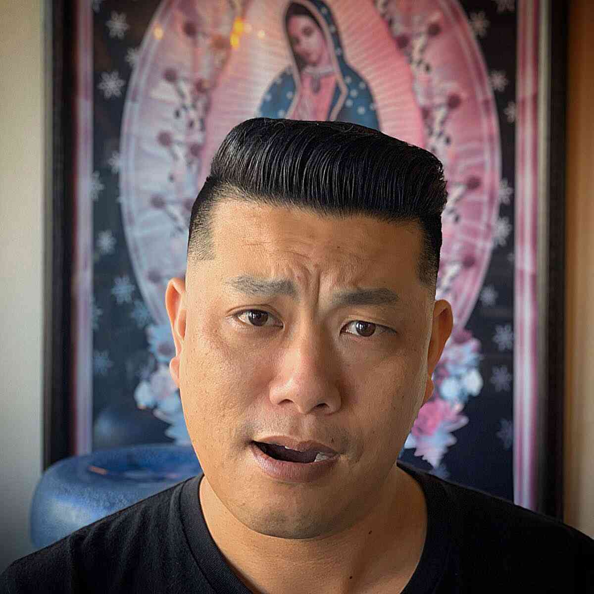 A picture of a men's short flat top haircut
