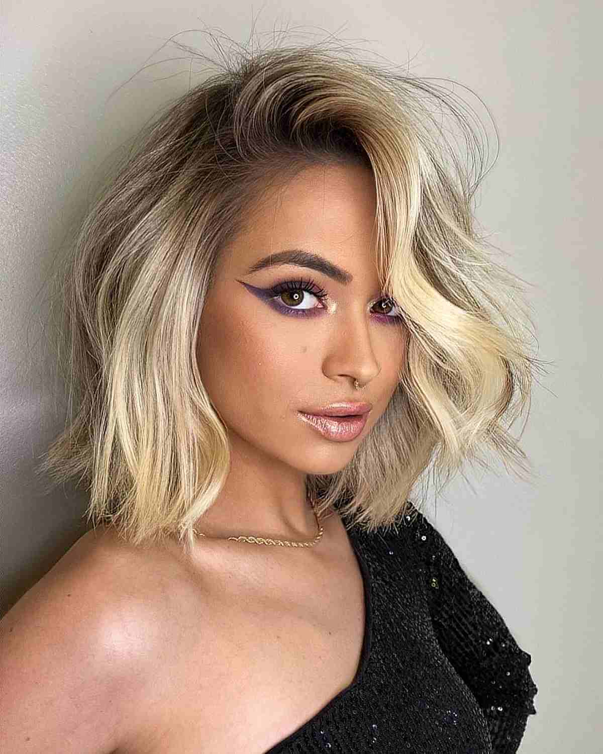 Messy Blonde Deeply Side-Parted Bob with Dark Roots