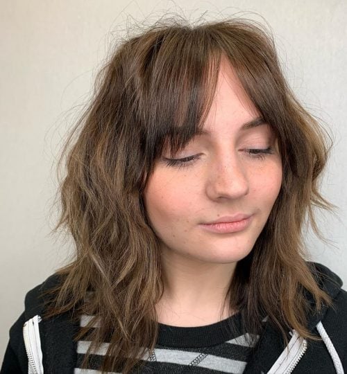 Messy Choppy Bob with Bangs and Layers for Round Faces