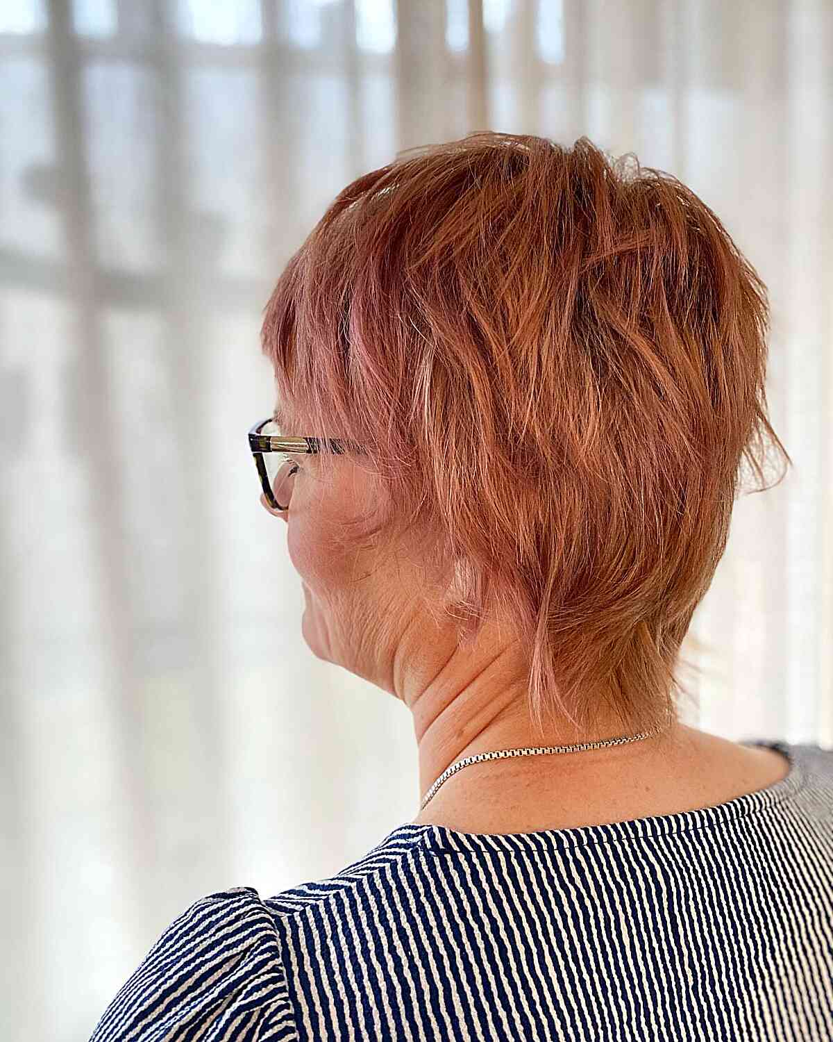 Messy Cropped Pixie Shag on Women Aged 60 with Copper Hair